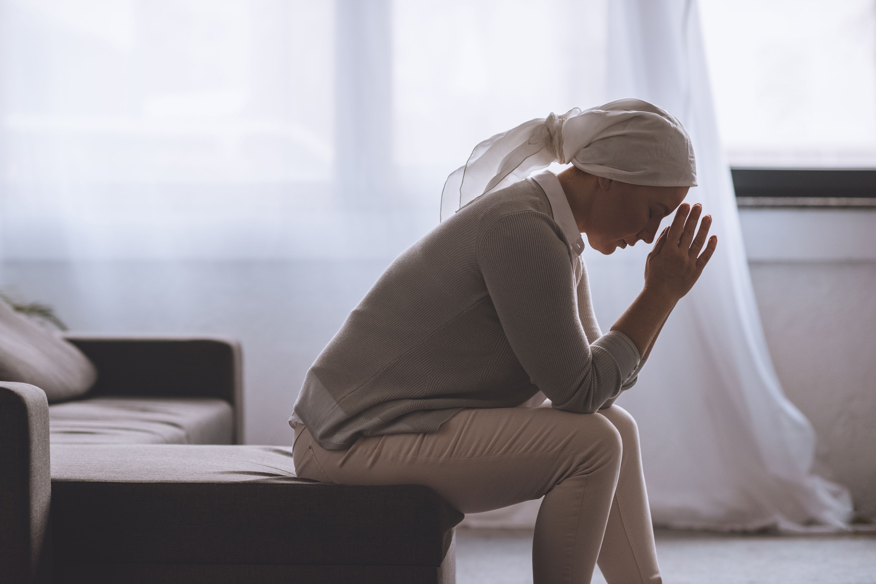 Woman fighting against cancer takes a moment to contemplate