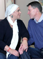 Middle aged couple with woman going through chemotherapy wearing Psi Bands